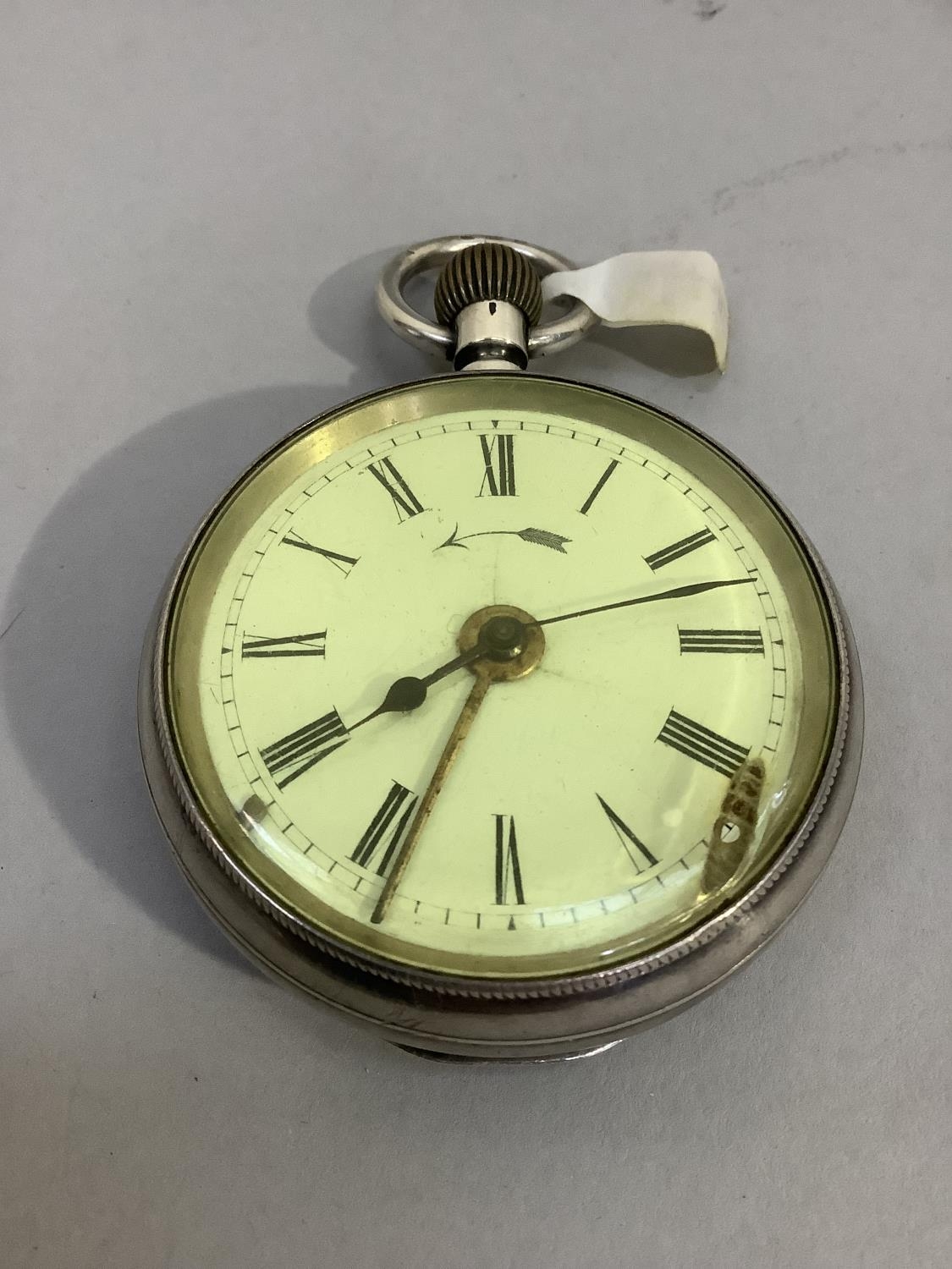 A late 19th century pocket watch alarm in open faced silver case with Swiss hallmarks, approximate