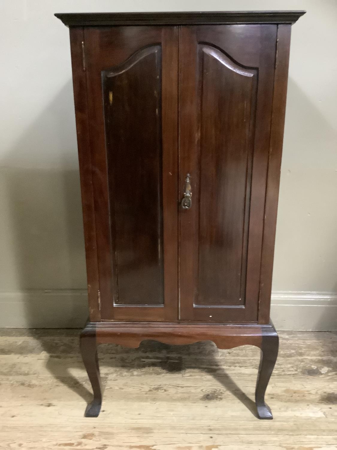An early 20th century mahogany music cabinet having two doors, the interior fitted with shallow - Image 2 of 2