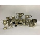 A quantity of mainly military silver plated trophy cups and mugs