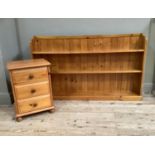 A set of pine open fronted book shelves together with a pine bedside cabinet