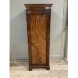 A 19th century mahogany single door wardrobe with indented panel door and on bracket feet, adapted