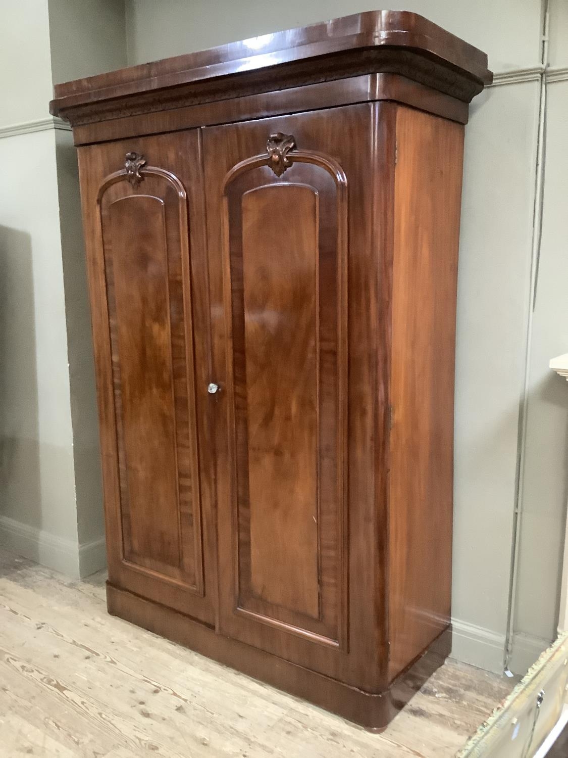 A Victorian mahogany crossbanded two drawer wardrobe having a moulded and foliate carved cornice - Image 2 of 5