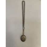 A Victorian oval silver locket with a chased chevron fronted pattern, hallmarked Chester 1882 for