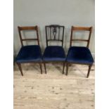 A pair of 19th century mahogany dining chairs with upholstered close nailed blue velvet seats
