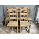 A set of six beech ladder back dining chairs