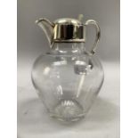 A Victorian silver mounted clear glass mounted water jug, Birmingham 1886, maker's mark for Edgar