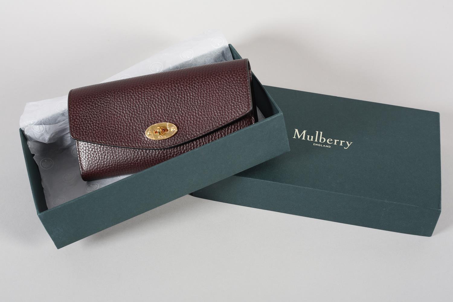 A Mulberry Darley wallet in oxblood grained leather, original box, Mulberry product card, condition: