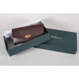A Mulberry Darley wallet in oxblood grained leather, original box, Mulberry product card, condition: