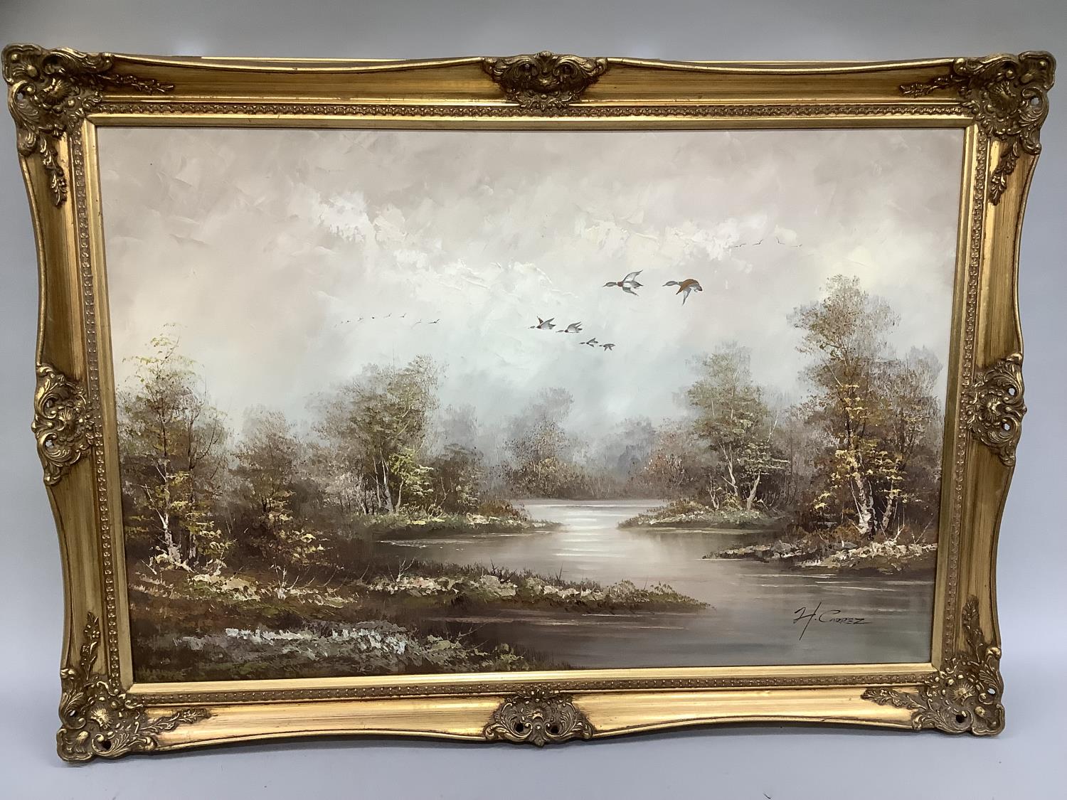 H. Carez, river and woodland with silver birch and geese in flight, oil on canvas, signed to lower
