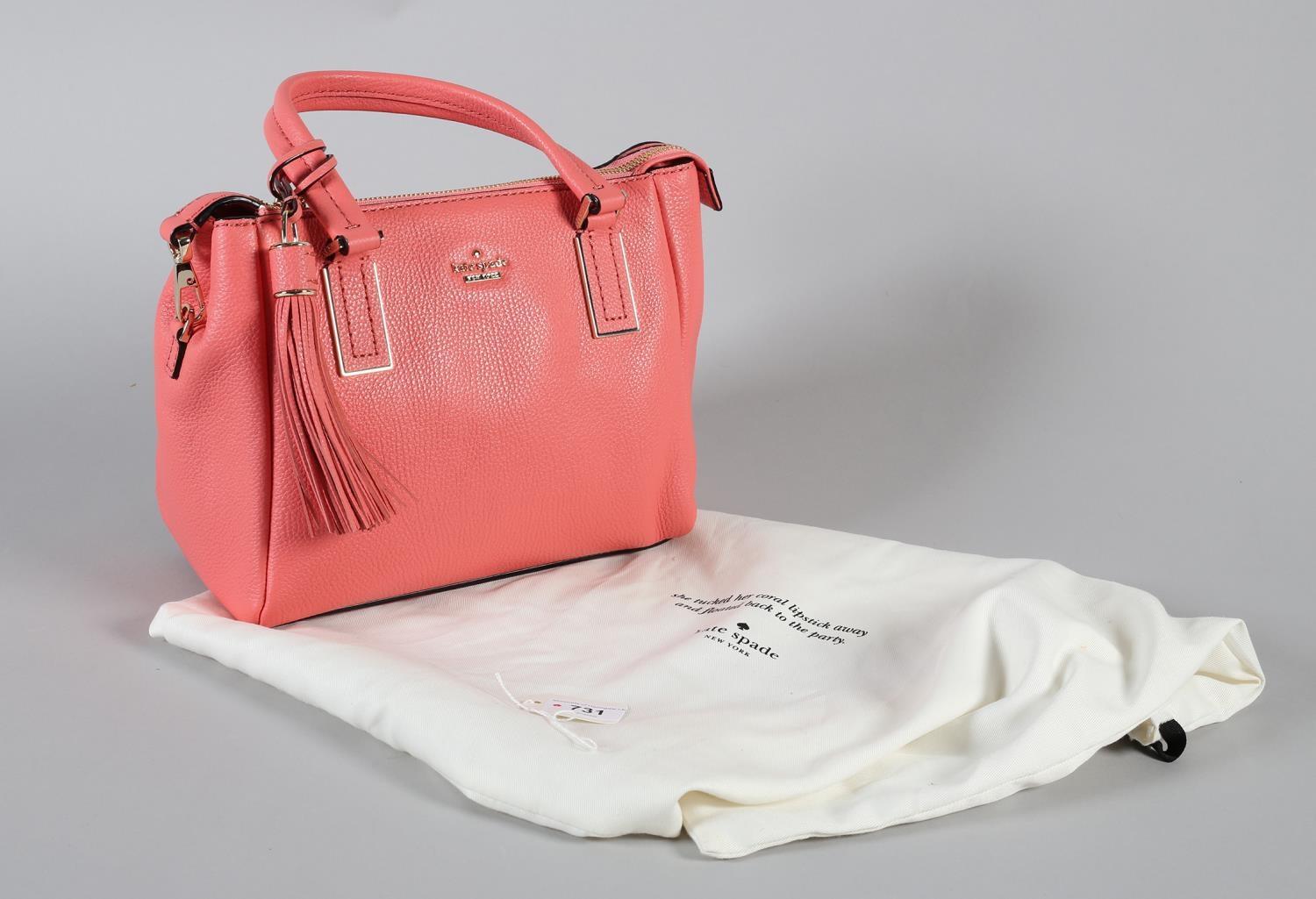 A Kate Spade Kingston Drive Alena crossbody handbag in coral pink grained leather, with strap,