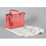 A Kate Spade Kingston Drive Alena crossbody handbag in coral pink grained leather, with strap,