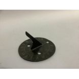 A mid 18th century bronze sundial, circular, engraved with the points of the compass, hours and