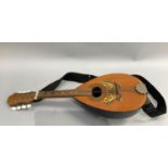 A mandolin with butterfly transfer decoration, 61cm