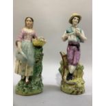 A pair of 19th century Staffordshire figures modelled as a farmer and his wife, polychrome painted