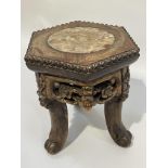 A Chinese marble inset hardwood urn stand of hexagonal outline on three legs, 17.5 cm diameter and