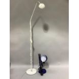 A white metal standard adjustable spot light together with an Ikea blue enamelled angle poise