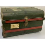 A vintage tin trunk painted in dark green and dark red, the lid lettered Mr Bruce Smith