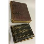 Two Victorian leather bound photograph albums containing a good quantity of portrait photographs