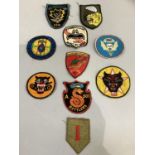Ten Vietnam War period In Country made patches.