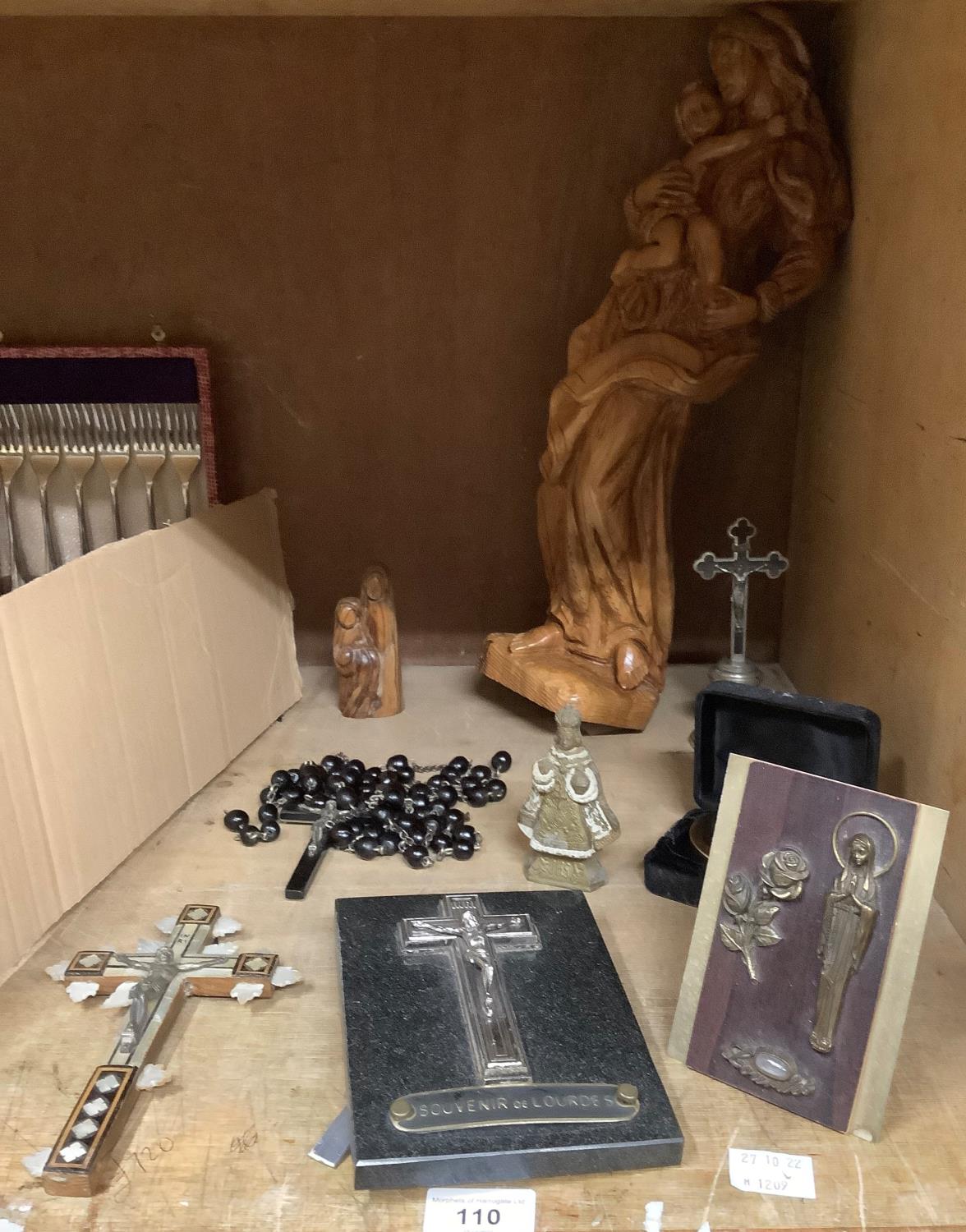 Religious icons including crucifix, rosary beads, olive wood carving of the Virgin Mother and child