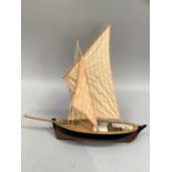 A model of a Loch Fyne skiff, 42cm long.