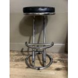 A black leatherette and tubular chrome cantilever stool