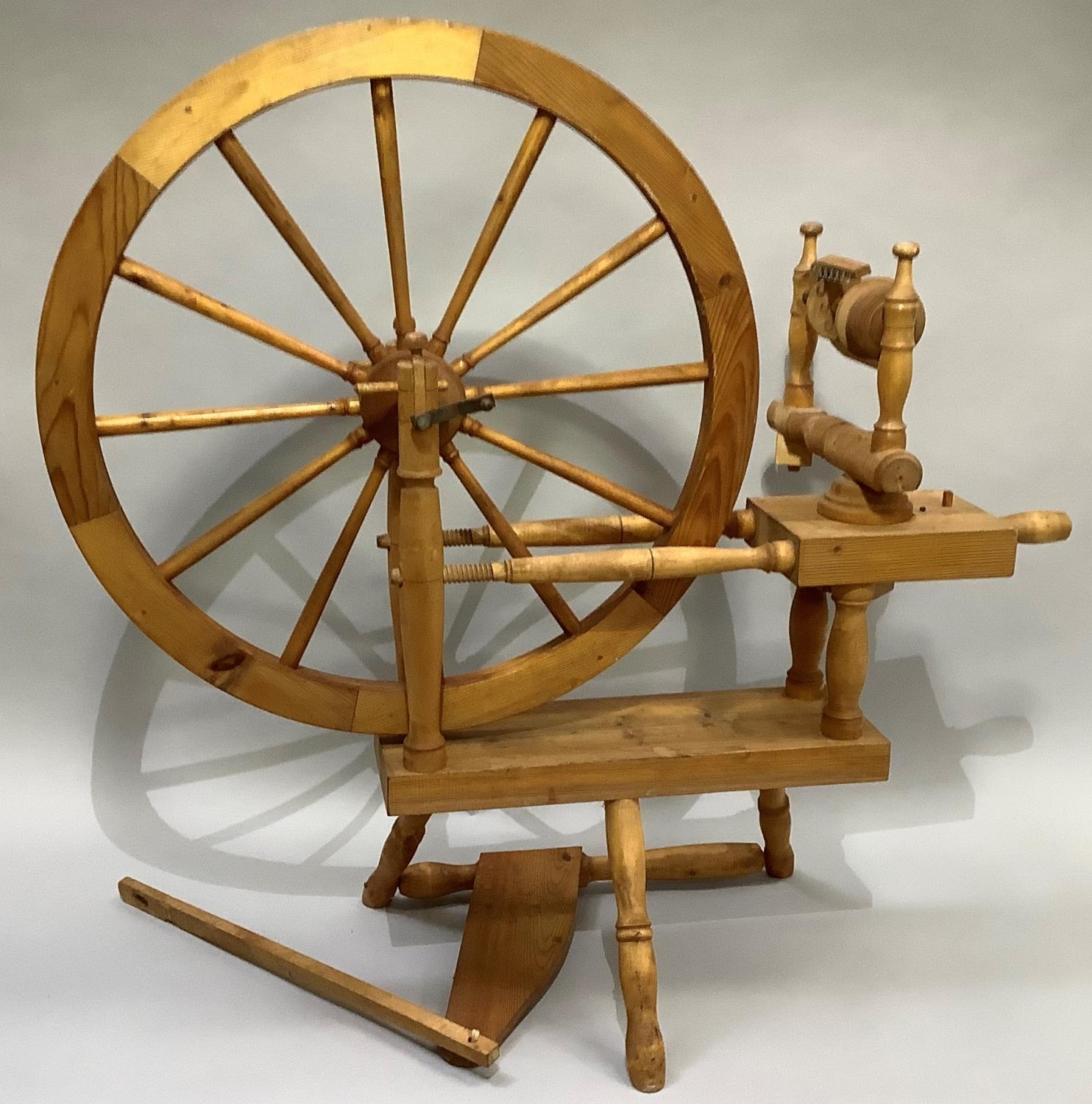 A modern pine spinning wheel