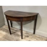 A 19th century mahogany demi-lune side table on moulded square legs