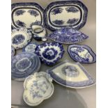 A collection of blue and white ware including two wedge shaped tureens, one by Midwinter of