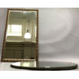 A gilt framed rectangular wall mirror and an oval bevelled wall mirror