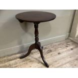 A 19th century mahogany tilt top tripod table with turned pedestal