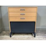 A home office beech finish chest of three drawers with tambour lower front