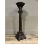 A mahogany torcher of doric column form