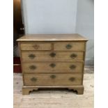 A 19th century oak chest of two short and three long graduated drawers with pierced brass back