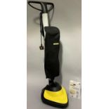 A Karcher floor polisher with additional buffing discs