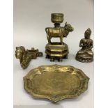 Four pieces of Indian brass ware including candle stick mounted on an oxen detachable from an