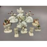 A collection of 19th century Staffordshire pottery including recumbent deer with bocage, a pair of