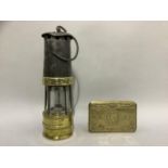 A brass miner's lamp, 27.5cm, together with a Christmas 1914 soldier's chocolate box