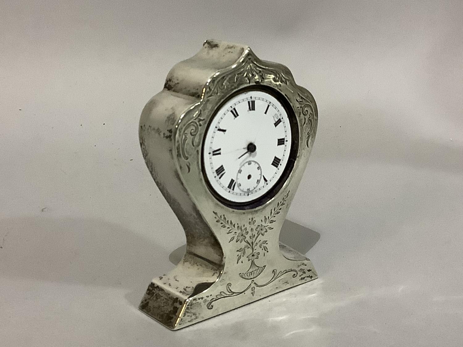 A silver faced boudoir clock, early 20th century engraved with foliate swags, the dial cracked, - Bild 2 aus 3