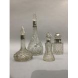 A Victorian cut glass silver mounted perfume bottle, London 1898 and three smaller silver mounted