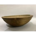 A late 19th/early 20th century turned wood dairy bowl, 30cm diameter x 10cm high.