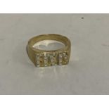 A ring pierced and diamond set to the 'ELVIS' head in yellow metal (tests as 9ct gold) in