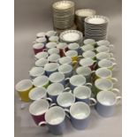 A large quantity of harlequin coffee cans and saucers with striped borders