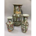 Three 19th century Chinese famille rose vases, variously painted with figures, peony blossom, garden