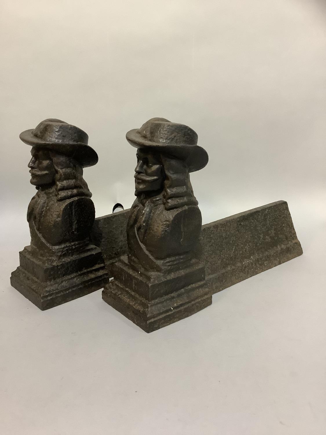 A pair of Victorian cast iron fire dogs modelled with the bust of a cavalier - Bild 2 aus 2