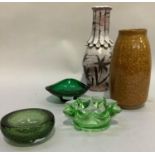 Three green glass dishes or ashtrays, a Studio Pottery vase of brown speckled glaze and another with