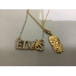 An 'ELVIS' pendant pierced and set with cubic zirconia in yellow metal (tests as 9ct gold)