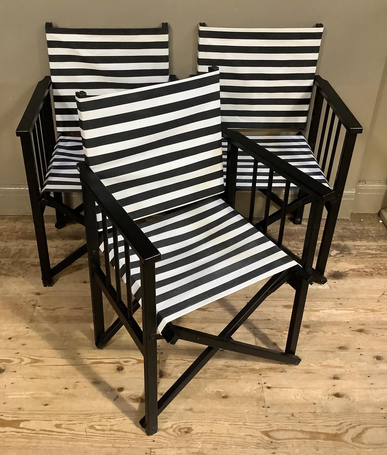 A set of three black framed director's chairs with black and white striped fabric seating - Bild 2 aus 3