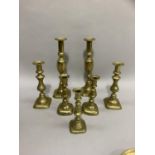 Three pairs of Victorian brass candlesticks and one odd brass stick, various sizes