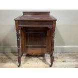 An Edwardian mahogany davenport